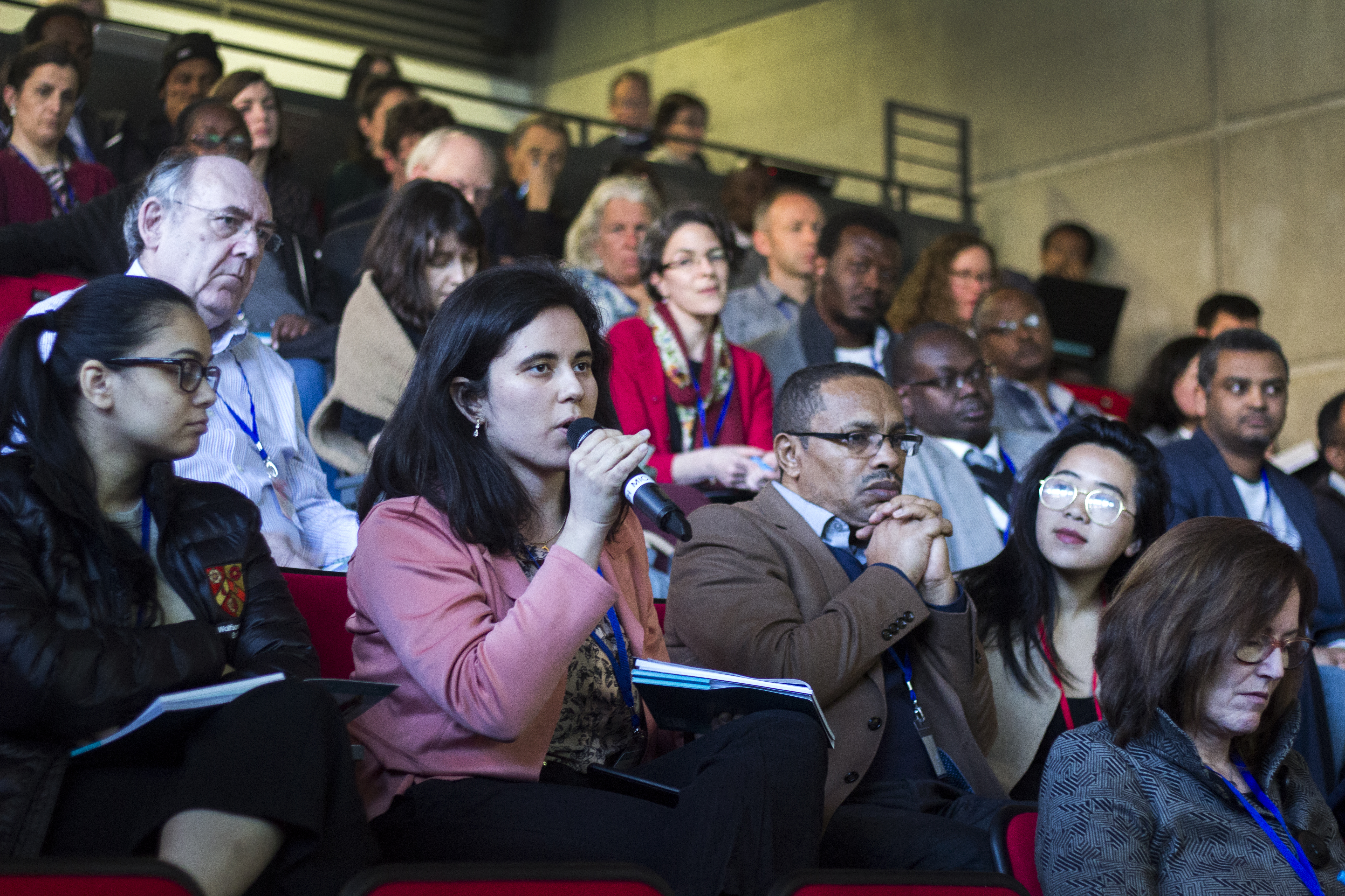 Participant asking a question during the REACH International Conference in Oxford; March 2019; Photo Credit: Alice Chautard/REACH