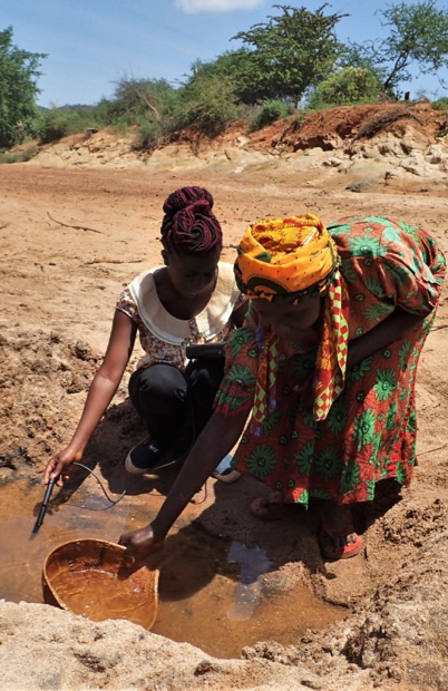 Measuring the conductivity of river-bed flow, which locals use for drinking-water. Credit: Saskia Nowicki