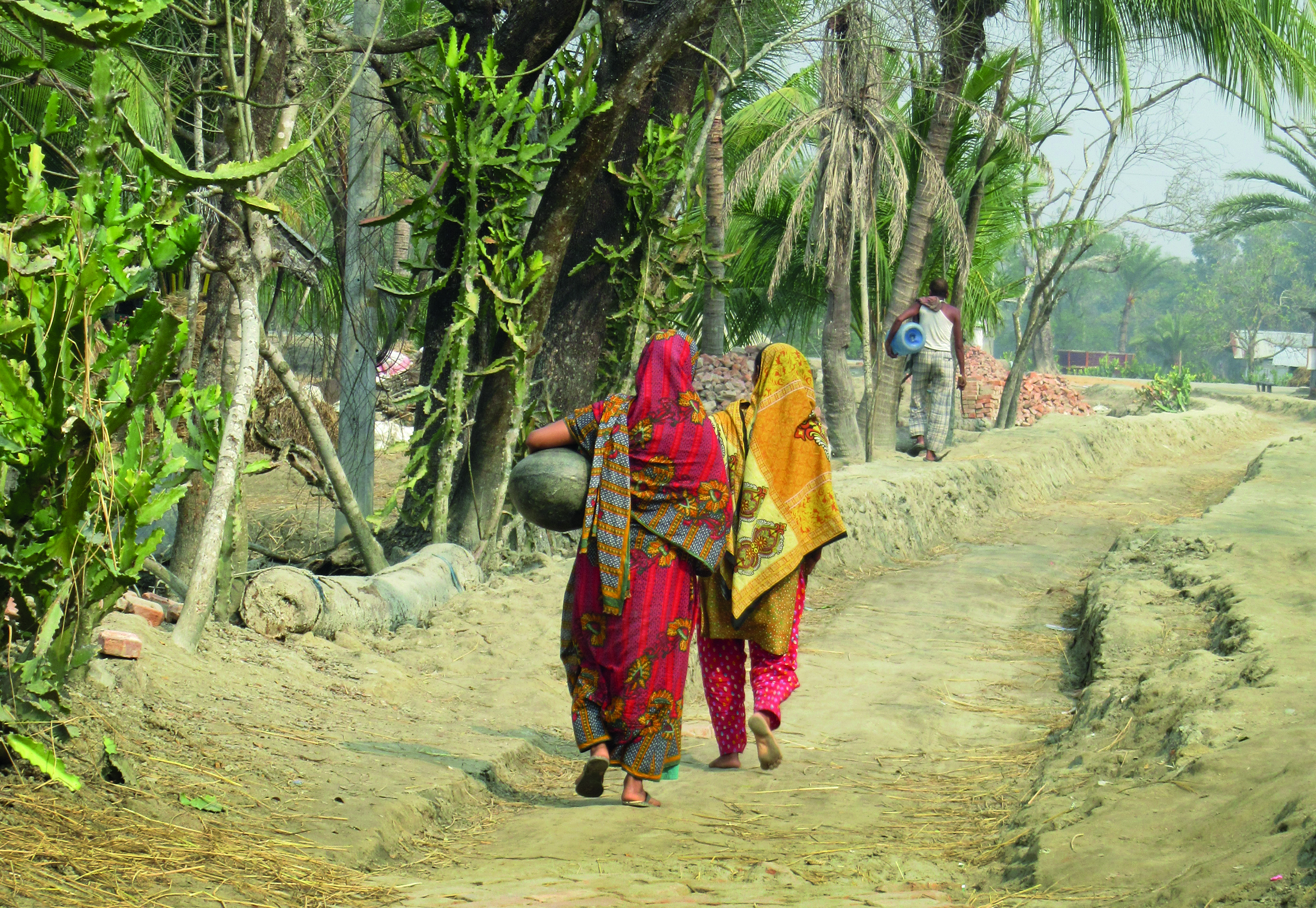 Women carrying water in Coastal Bangladesh, Khulna district